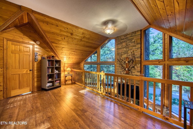 224 Eagle Blf, Jamestown, TN 38556 - additional living space featuring lofted ceiling, a ceiling fan, wood-type flooring, wooden walls, and wood ceiling