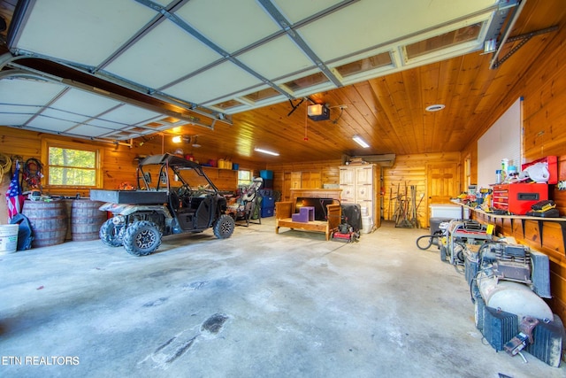 224 Eagle Blf, Jamestown, TN 38556 - garage with a garage door opener and wooden walls