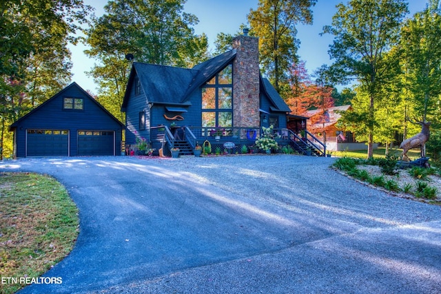 224 Eagle Blf, Jamestown, TN 38556 - rustic home with a garage, a chimney, an outdoor structure, and stairs