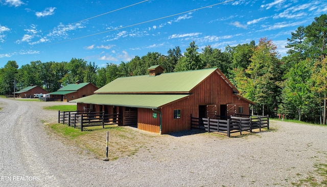 224 Eagle Blf, Jamestown, TN 38556 - view of home's exterior featuring an exterior structure, a metal roof, and an outdoor structure