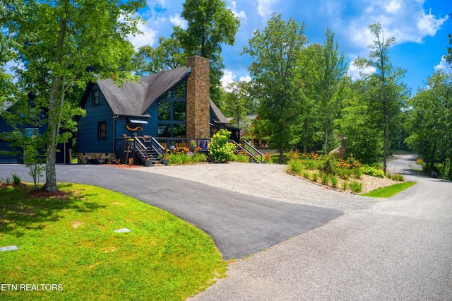224 Eagle Blf, Jamestown, TN 38556 - view of front of home featuring a chimney and asphalt driveway