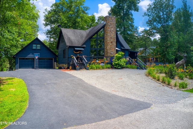 224 Eagle Blf, Jamestown, TN 38556 - rustic home with a garage, a chimney, an outbuilding, and roof with shingles