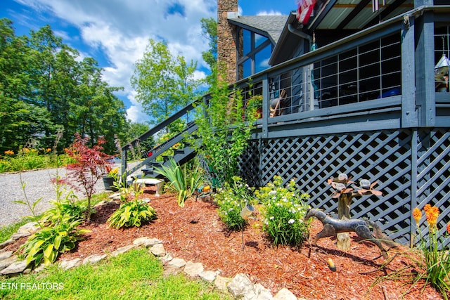 224 Eagle Blf, Jamestown, TN 38556 - view of property exterior with stairway, a wooden deck, and a chimney