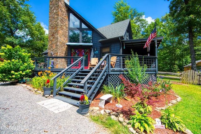 224 Eagle Blf, Jamestown, TN 38556 - chalet / cabin with a deck, roof with shingles, a chimney, and stairway