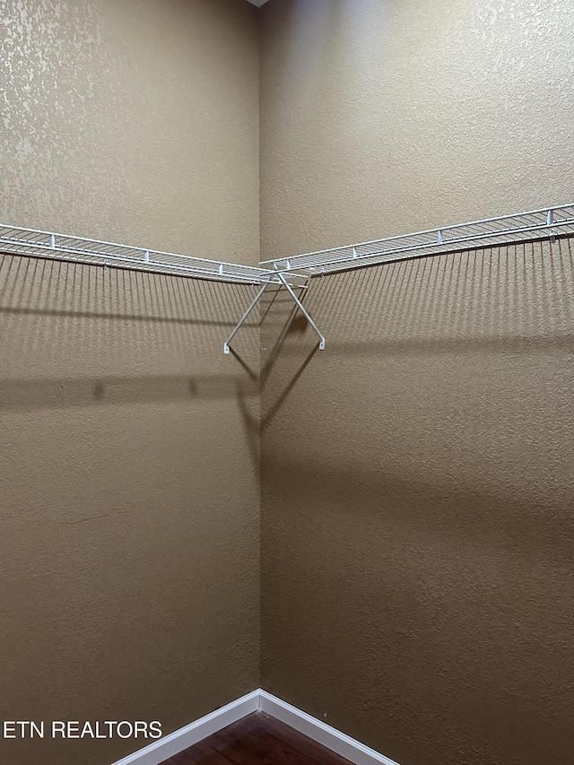 901 Kyle St, Lafollette, TN 37766 - walk in closet with dark wood-style floors