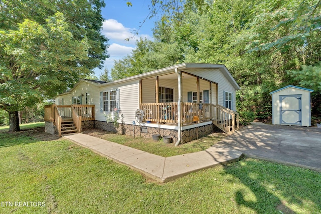 225 N Chuckey Ruritan Rd, Chuckey, TN 37641 - view of front of house with a storage shed, a front lawn, covered porch, and stairway