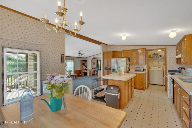 225 N Chuckey Ruritan Rd, Chuckey, TN 37641 - dining room with washer / dryer, wallpapered walls, ornamental molding, vaulted ceiling, and healthy amount of natural light
