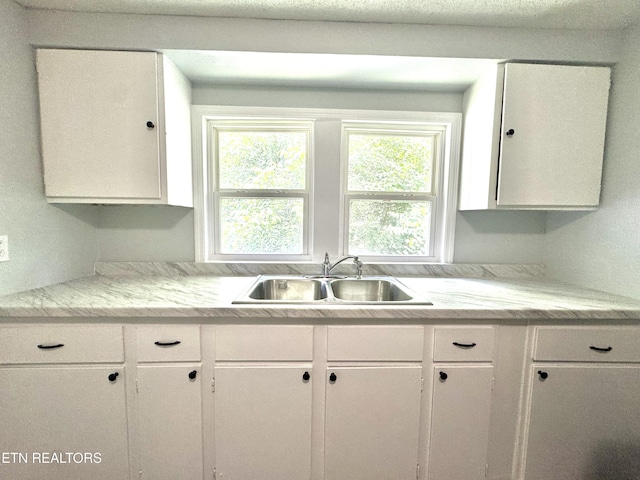 914 S 13th St, Lafollette, TN 37766 - kitchen featuring white cabinets and light countertops