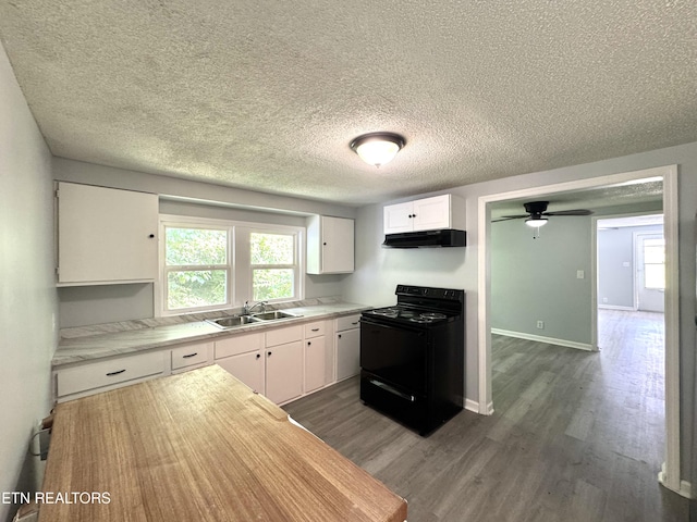 914 S 13th St, Lafollette, TN 37766 - kitchen with black range with electric cooktop, under cabinet range hood, dark wood-style floors, white cabinets, and a textured ceiling