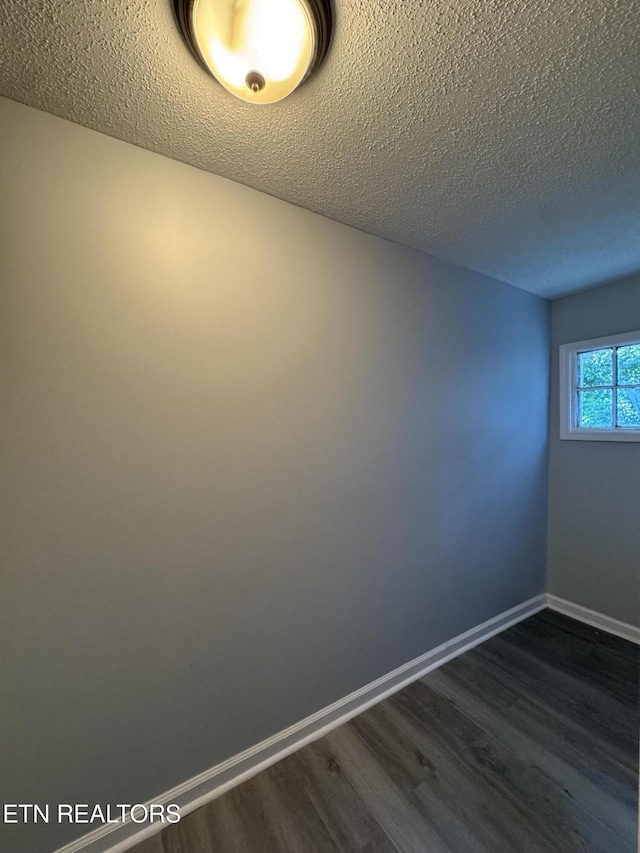 914 S 13th St, Lafollette, TN 37766 - unfurnished room with dark wood-style floors and a textured ceiling