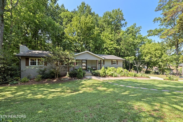 1521 Aldenwood Ln, Knoxville, TN 37919 - ranch-style home with a chimney, a front lawn, brick siding, and a porch