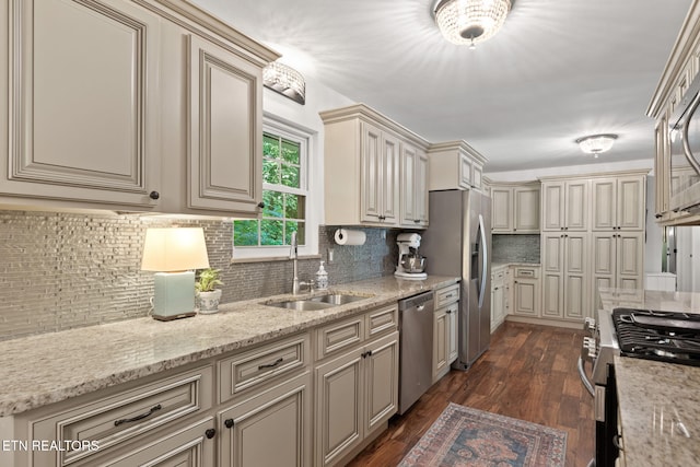 1521 Aldenwood Ln, Knoxville, TN 37919 - kitchen with cream cabinetry, appliances with stainless steel finishes, and decorative backsplash
