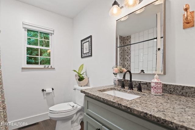 1521 Aldenwood Ln, Knoxville, TN 37919 - full bath with vanity, tiled shower, and wood finished floors