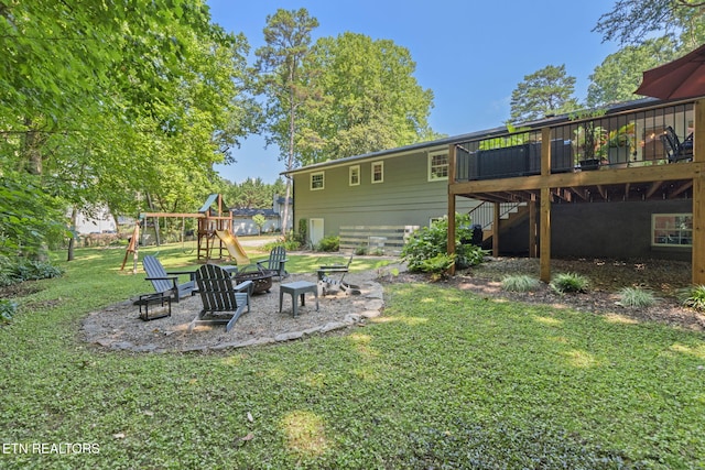 1521 Aldenwood Ln, Knoxville, TN 37919 - rear view of house featuring an outdoor fire pit, stairway, a playground, a yard, and a deck