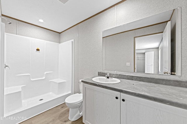 417 Cain Ave, Morristown, TN 37813 - full bath featuring wood finished floors, vanity, a shower, a textured wall, and crown molding