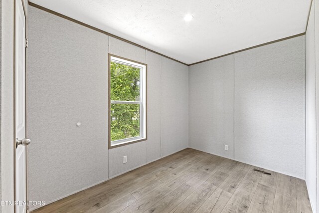 417 Cain Ave, Morristown, TN 37813 - unfurnished room with wood finished floors and crown molding