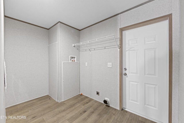417 Cain Ave, Morristown, TN 37813 - laundry room featuring light wood-style floors, hookup for an electric dryer, ornamental molding, and hookup for a washing machine