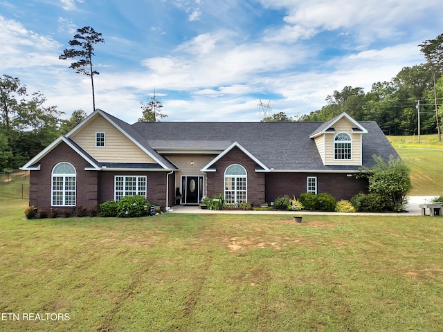 5728 Hickory Valley Rd, Heiskell, TN 37754 - traditional-style home featuring a front lawn, a shingled roof, and brick siding