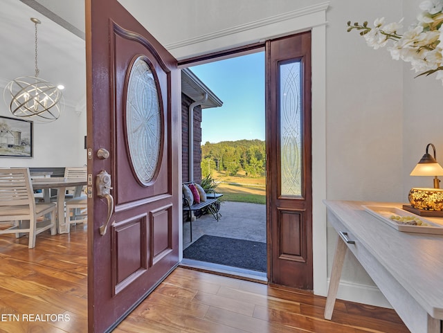 5728 Hickory Valley Rd, Heiskell, TN 37754 - entrance foyer featuring a chandelier and wood finished floors
