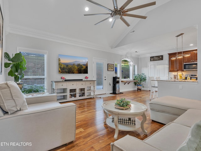 5728 Hickory Valley Rd, Heiskell, TN 37754 - living room with ceiling fan, ornamental molding, light wood-type flooring, high vaulted ceiling, and recessed lighting