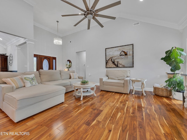 5728 Hickory Valley Rd, Heiskell, TN 37754 - living room with high vaulted ceiling, a ceiling fan, ornate columns, wood finished floors, and crown molding