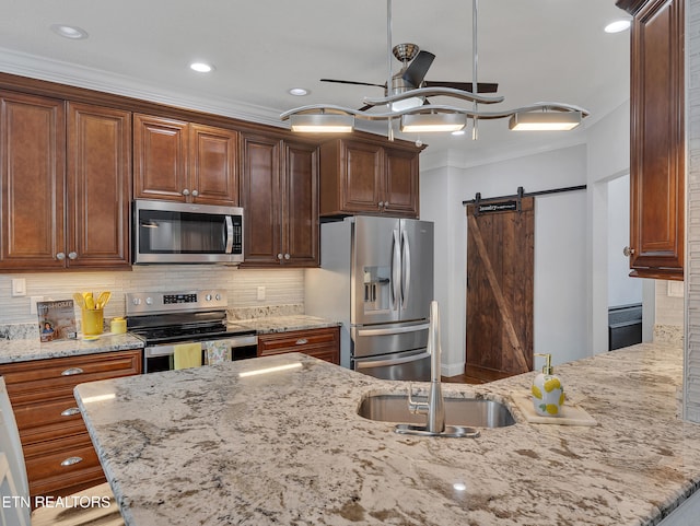 5728 Hickory Valley Rd, Heiskell, TN 37754 - kitchen featuring appliances with stainless steel finishes, crown molding, ceiling fan, light stone countertops, and backsplash
