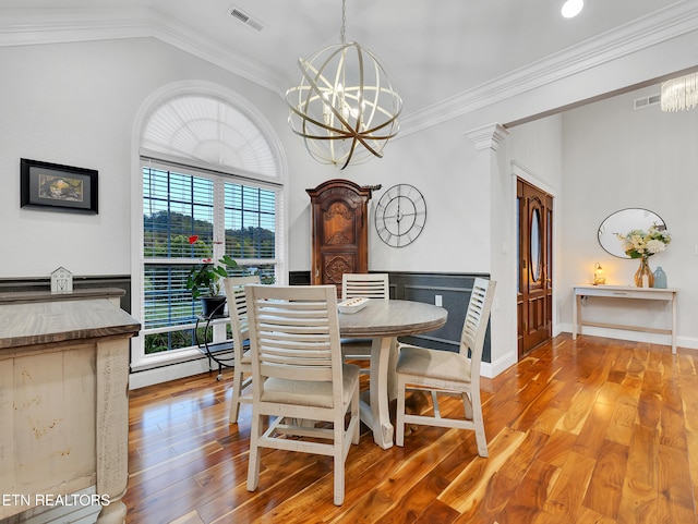 5728 Hickory Valley Rd, Heiskell, TN 37754 - dining area featuring a chandelier, wood finished floors, and ornamental molding