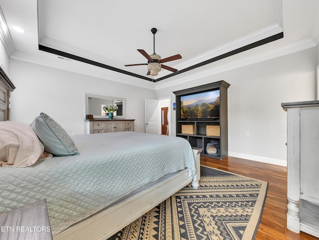 5728 Hickory Valley Rd, Heiskell, TN 37754 - bedroom with hardwood / wood-style flooring, a tray ceiling, ornamental molding, a ceiling fan, and recessed lighting