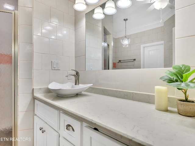 5728 Hickory Valley Rd, Heiskell, TN 37754 - bathroom with tile walls, vanity, and ornamental molding