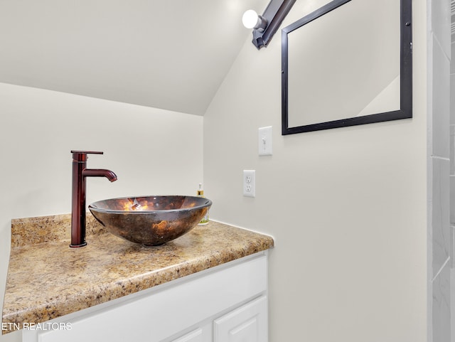 5728 Hickory Valley Rd, Heiskell, TN 37754 - bathroom with lofted ceiling and vanity