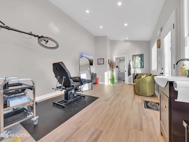 5728 Hickory Valley Rd, Heiskell, TN 37754 - workout area with light wood-style flooring, recessed lighting, and high vaulted ceiling
