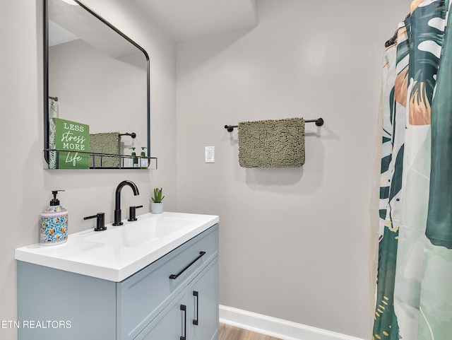 5728 Hickory Valley Rd, Heiskell, TN 37754 - full bathroom with vanity and wood finished floors