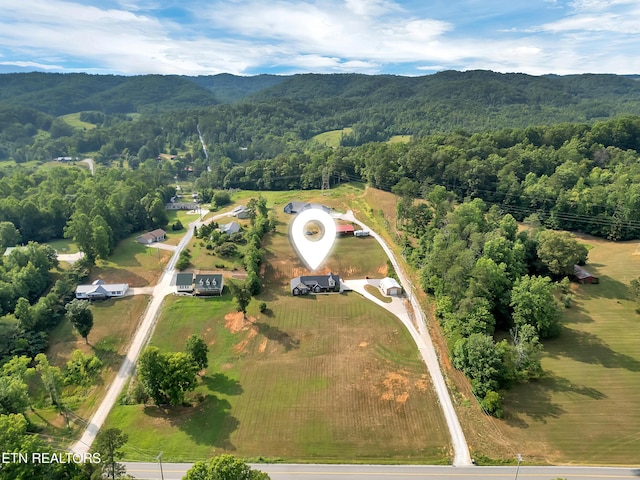 5728 Hickory Valley Rd, Heiskell, TN 37754 - aerial overview of property's location with a forest and a mountainous background