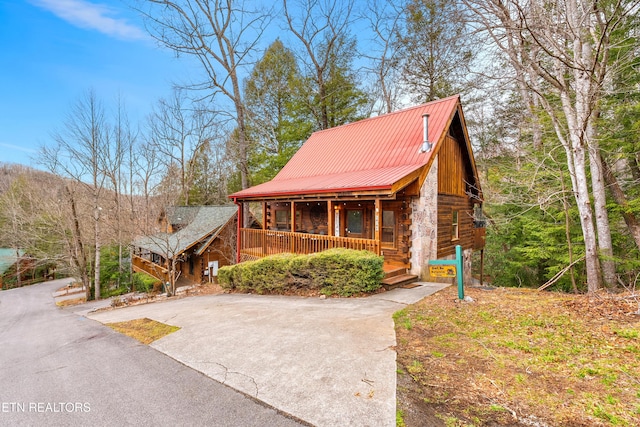 524 Hoot Owl Way, Gatlinburg, TN 37738 - log cabin with covered porch, a metal roof, log siding, and stone siding