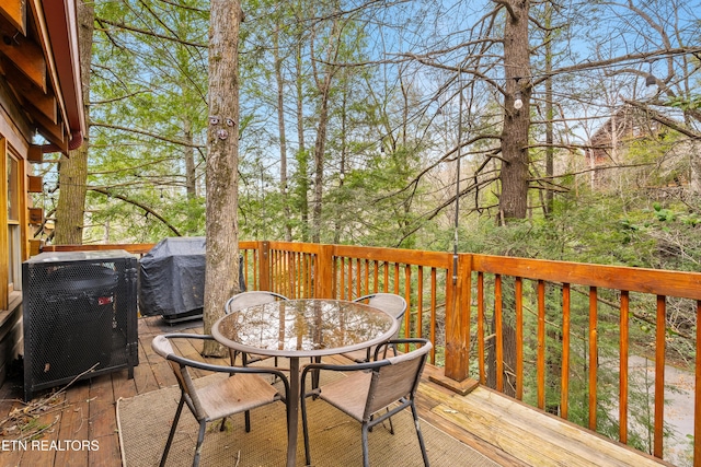 524 Hoot Owl Way, Gatlinburg, TN 37738 - wooden terrace featuring outdoor dining space and a grill