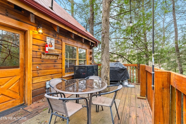 524 Hoot Owl Way, Gatlinburg, TN 37738 - wooden deck featuring a grill and outdoor dining space