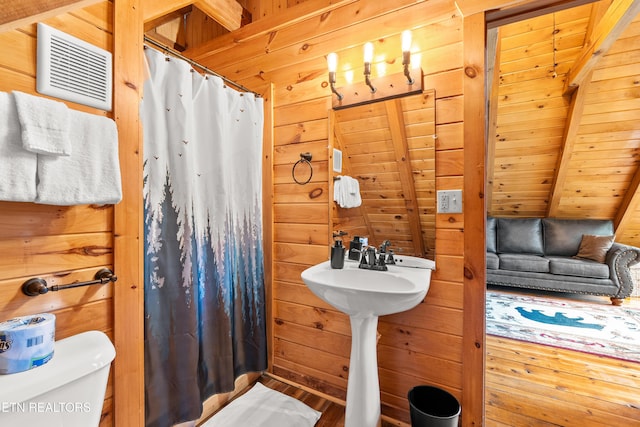 524 Hoot Owl Way, Gatlinburg, TN 37738 - full bath with wooden walls, curtained shower, and wood finished floors