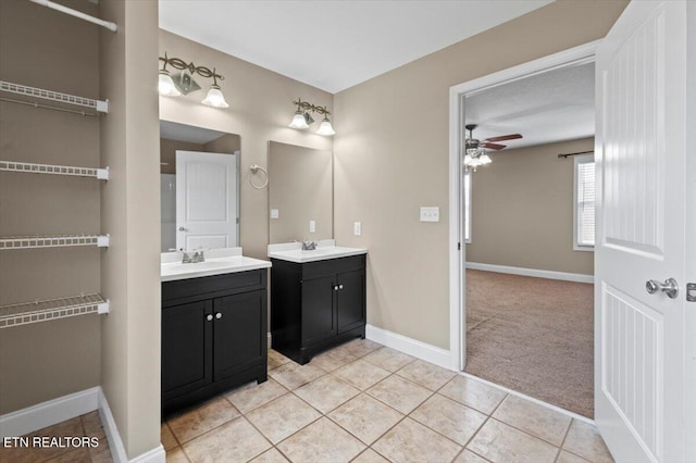 168 Thelma Cir, Jacksboro, TN 37757 - bathroom featuring two vanities, ceiling fan, and tile patterned flooring