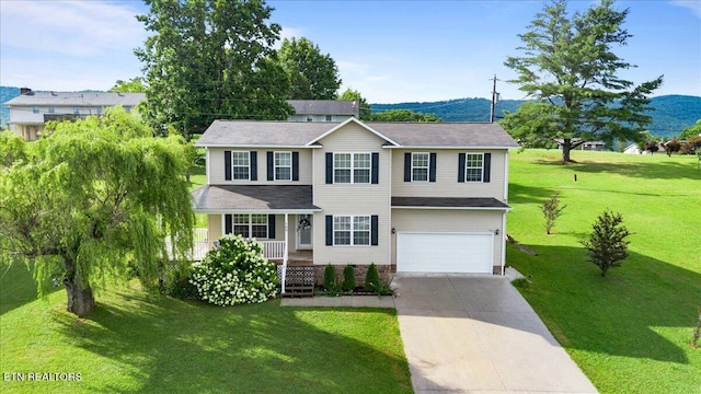 168 Thelma Cir, Jacksboro, TN 37757 - view of front of home with an attached garage, a porch, driveway, and a front lawn