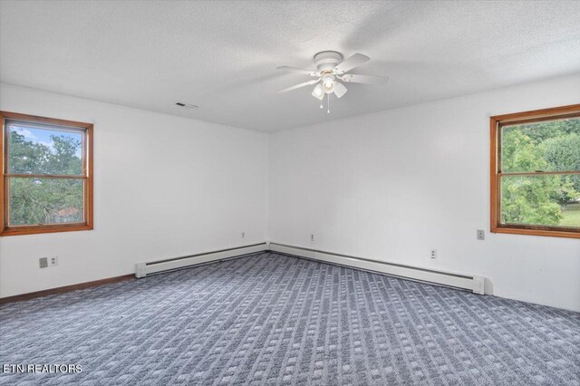 261 Lance Ln, Lafollette, TN 37766 - unfurnished room featuring carpet, healthy amount of natural light, a ceiling fan, a textured ceiling, and a baseboard heating unit