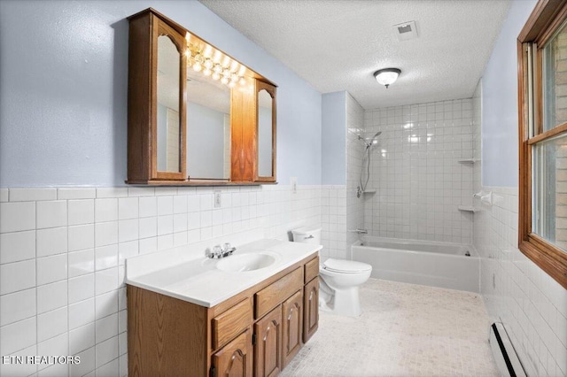261 Lance Ln, Lafollette, TN 37766 - bathroom with baseboard heating, tile walls, vanity, shower / tub combination, and a textured ceiling