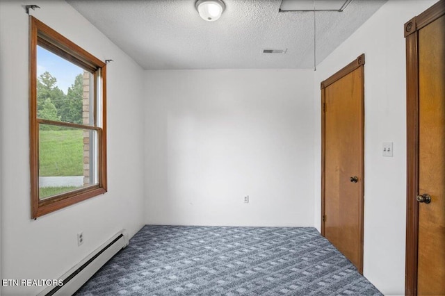 261 Lance Ln, Lafollette, TN 37766 - empty room with baseboard heating, a textured ceiling, and carpet flooring