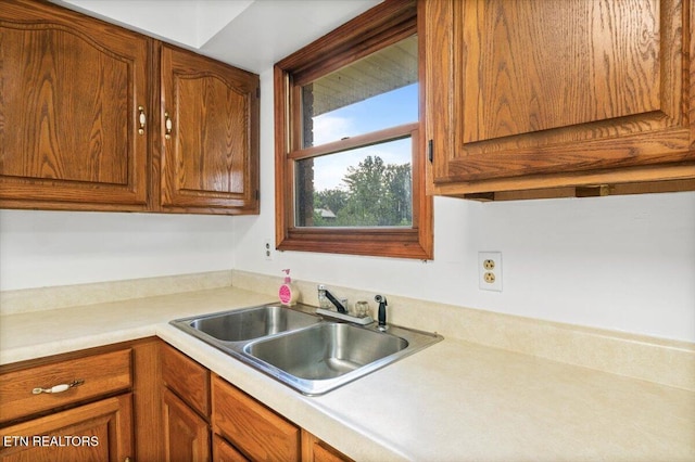261 Lance Ln, Lafollette, TN 37766 - kitchen with light countertops and brown cabinetry