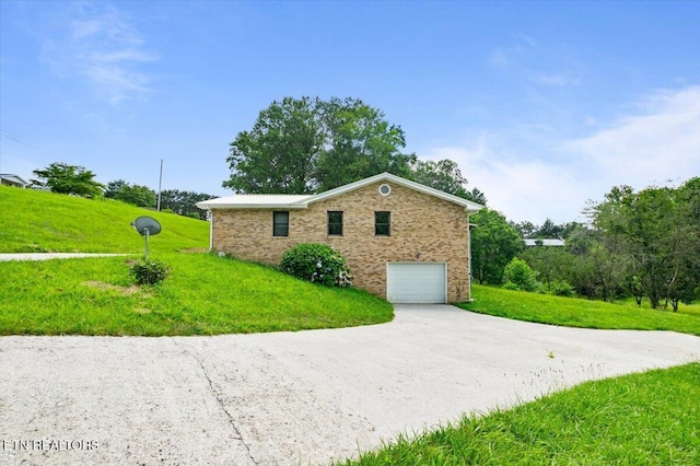 261 Lance Ln, Lafollette, TN 37766 - view of side of home with a garage, concrete driveway, and a yard