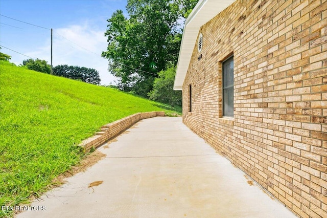 261 Lance Ln, Lafollette, TN 37766 - view of home's exterior with brick siding and a patio