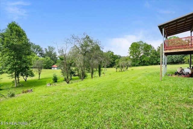 261 Lance Ln, Lafollette, TN 37766 - view of green lawn with a wooden deck and view of scattered trees