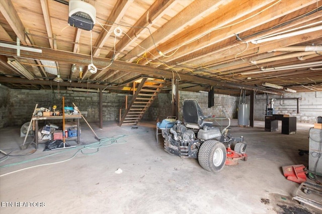 261 Lance Ln, Lafollette, TN 37766 - unfinished below grade area featuring gas water heater and stairway