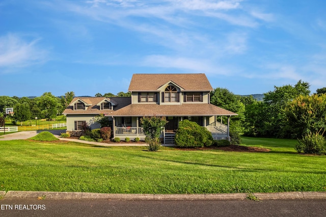 3938 Settlers Trl, Kodak, TN 37764 - view of front of home featuring a porch, a front lawn, and driveway