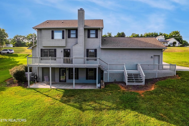 3938 Settlers Trl, Kodak, TN 37764 - back of house featuring a patio, a chimney, a wooden deck, and a lawn