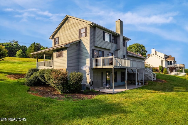 3938 Settlers Trl, Kodak, TN 37764 - rear view of property with a chimney, a patio area, a deck, a lawn, and stairway